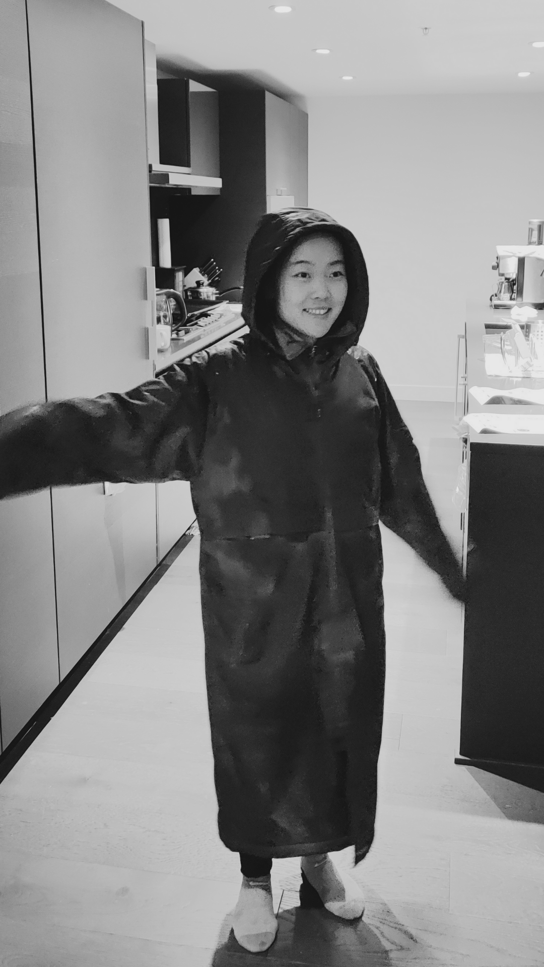Swimmer models a sporti branded swim parka