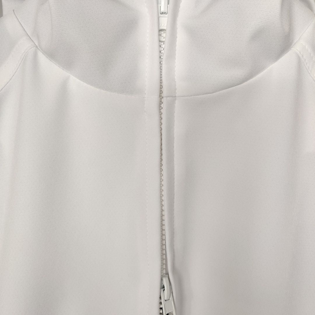 Front zipper of a white swim parka