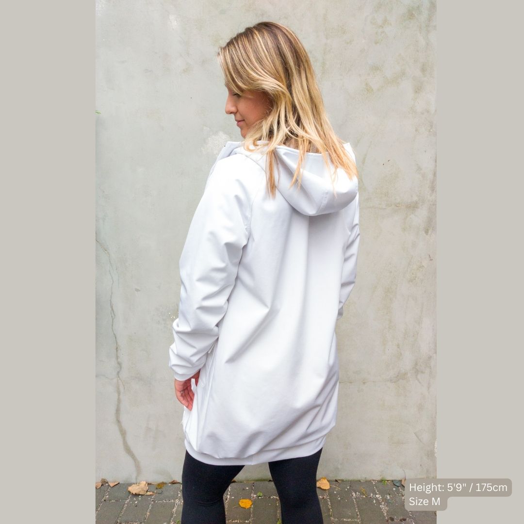 Female model wearing a white swim parka