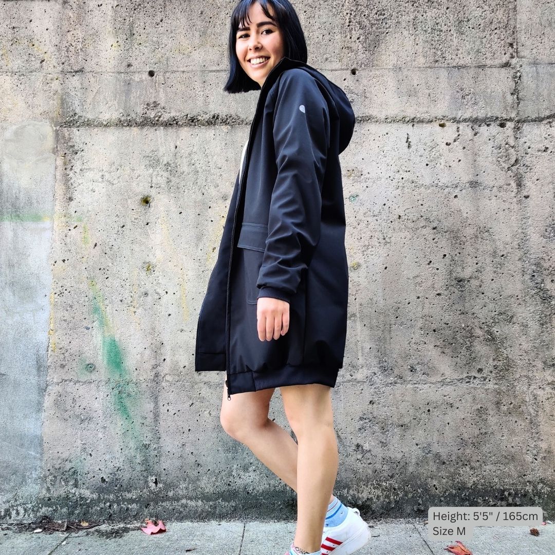 Swimmer (5'5" tall) wears a black swim parka in medium size over white blouse and blue denim skirt