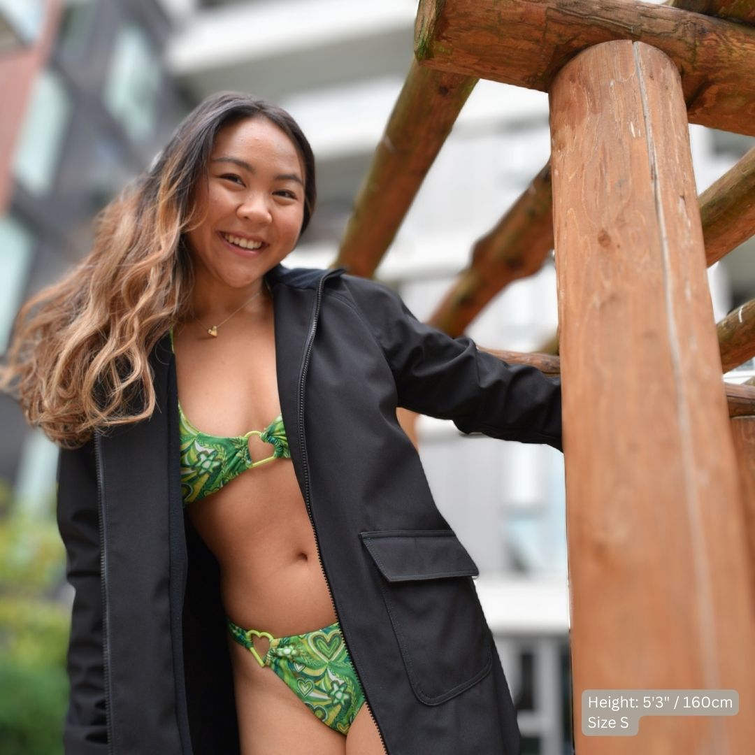 Swimmer (5'3" tall) wears a black swim parka over her green bikini